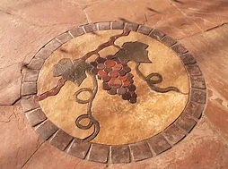 Stamped concrete grape medallion feature in the garden